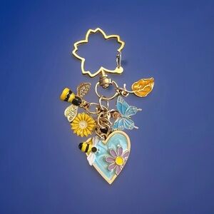 Blue floral bee bag charm